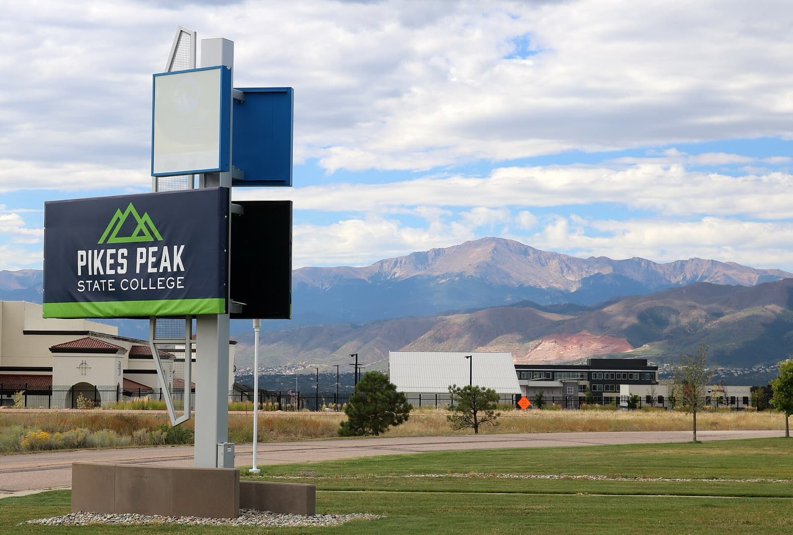 Pikes Peak State College sign with Pikes Peak in the background